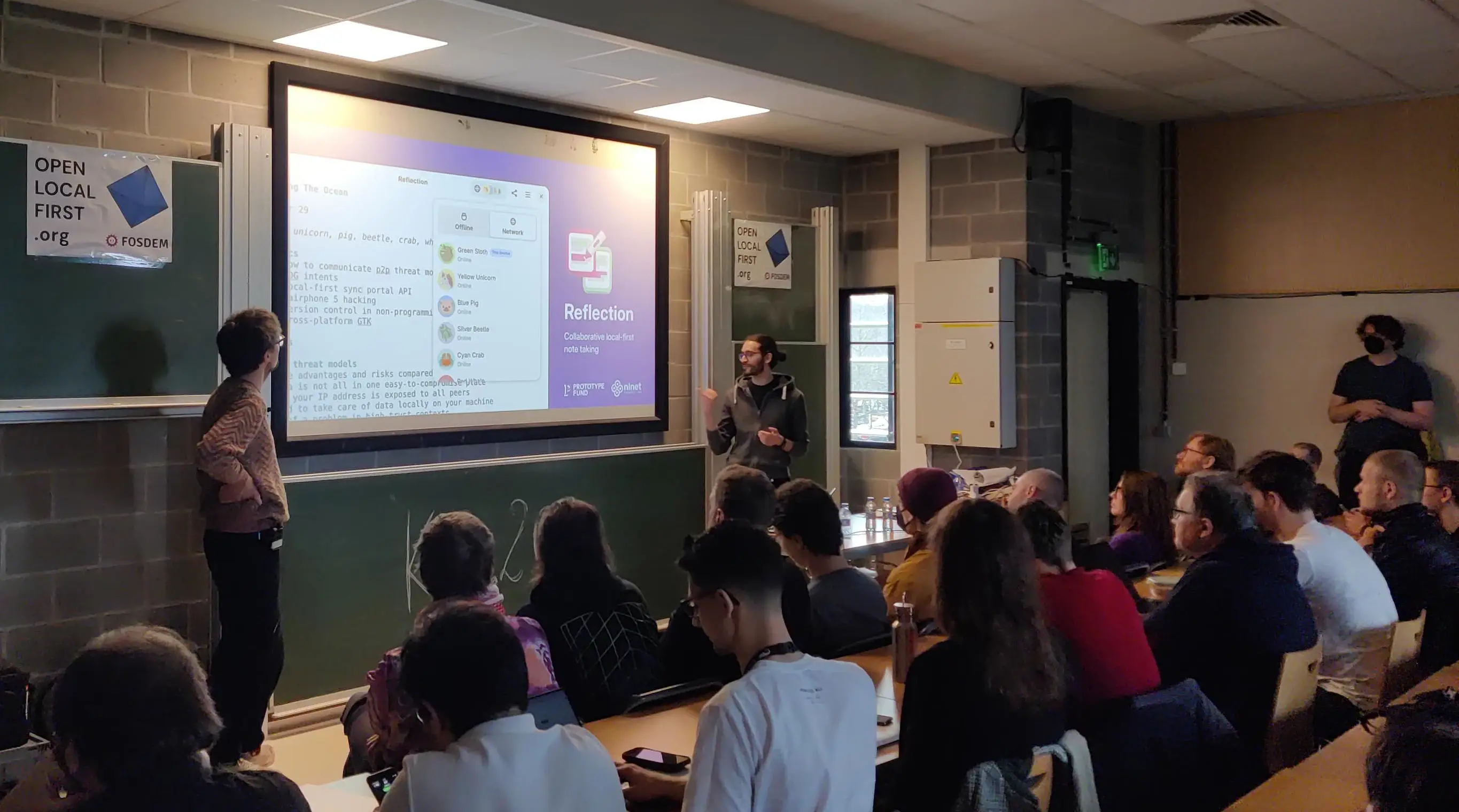 Andreas and Tobias giving a FOSDEM talk about Reflection in the Open Local First devroom.